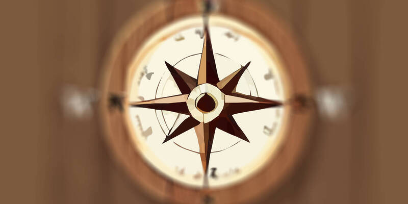 A compass on a wooden ground. Remove the labeling and letters.